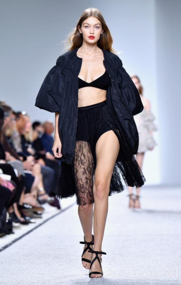 Model Gigi Hadid presents a creation for Elie Saab